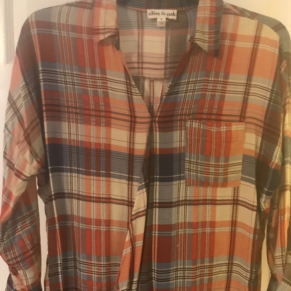 Cute burnt orange plaid top. Diagonal front.